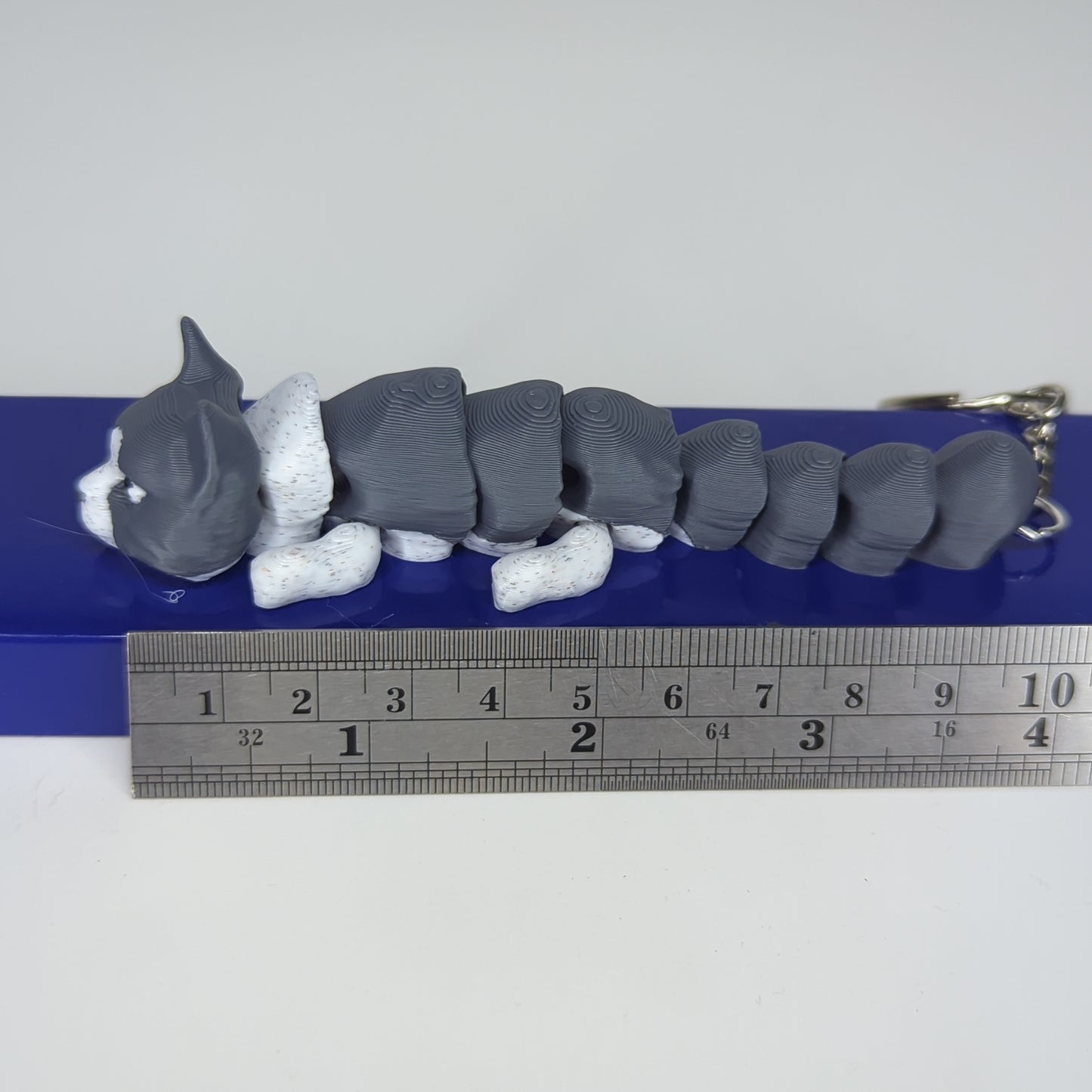 Gray tuxedo flexi keychain