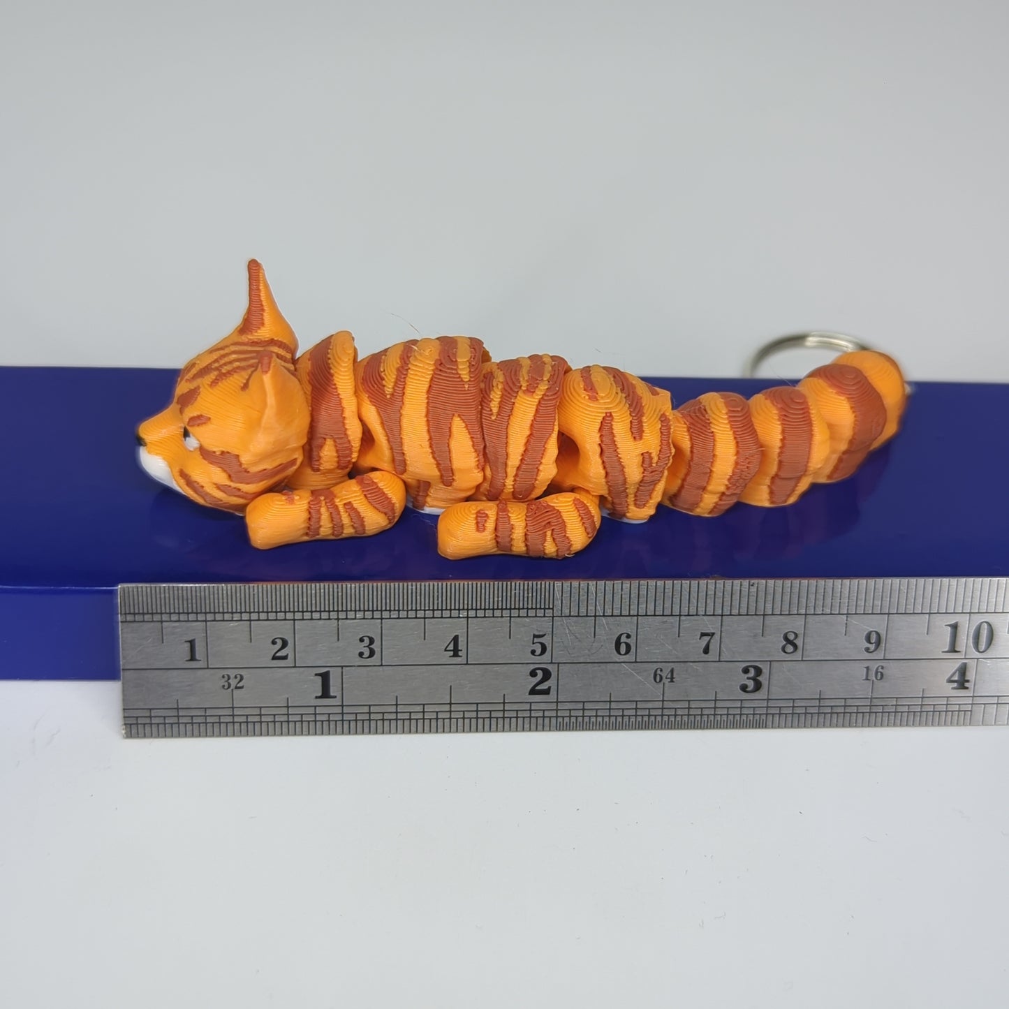 Tabby bright orange flexi keychain