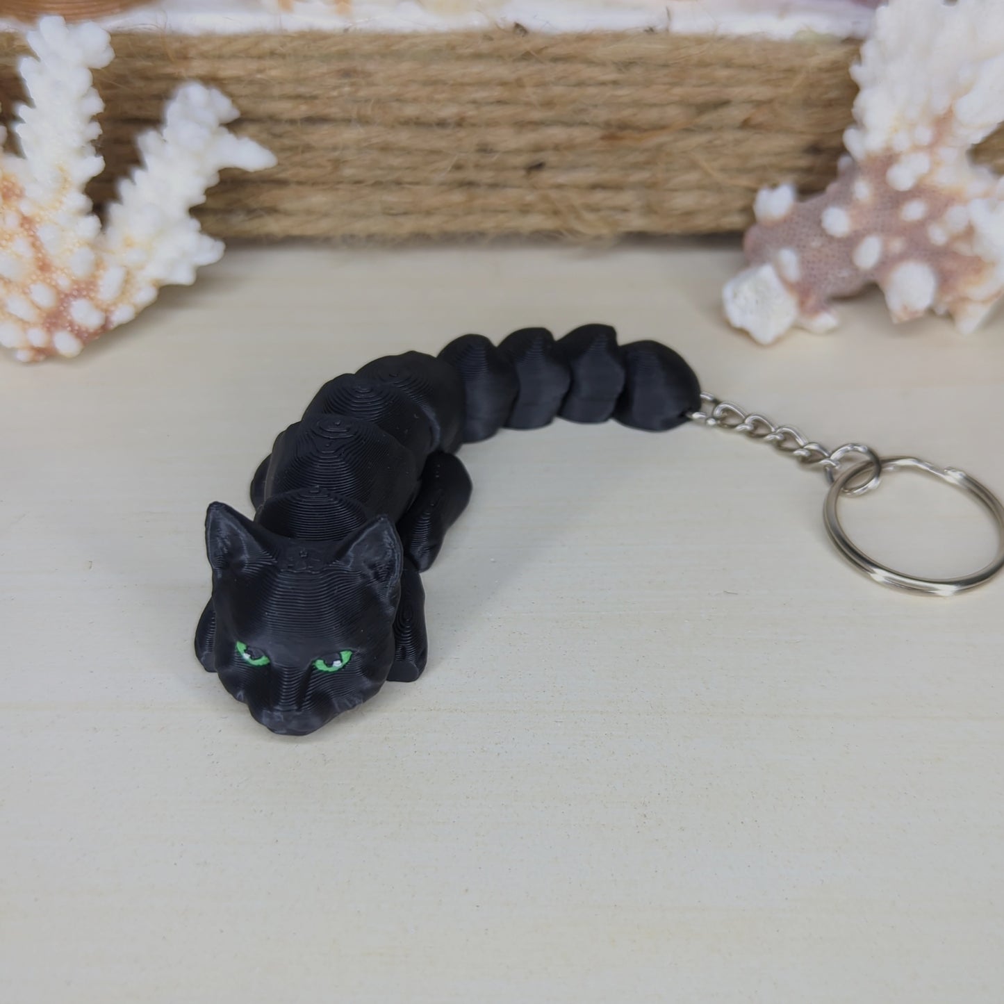Black cat flexi keychain